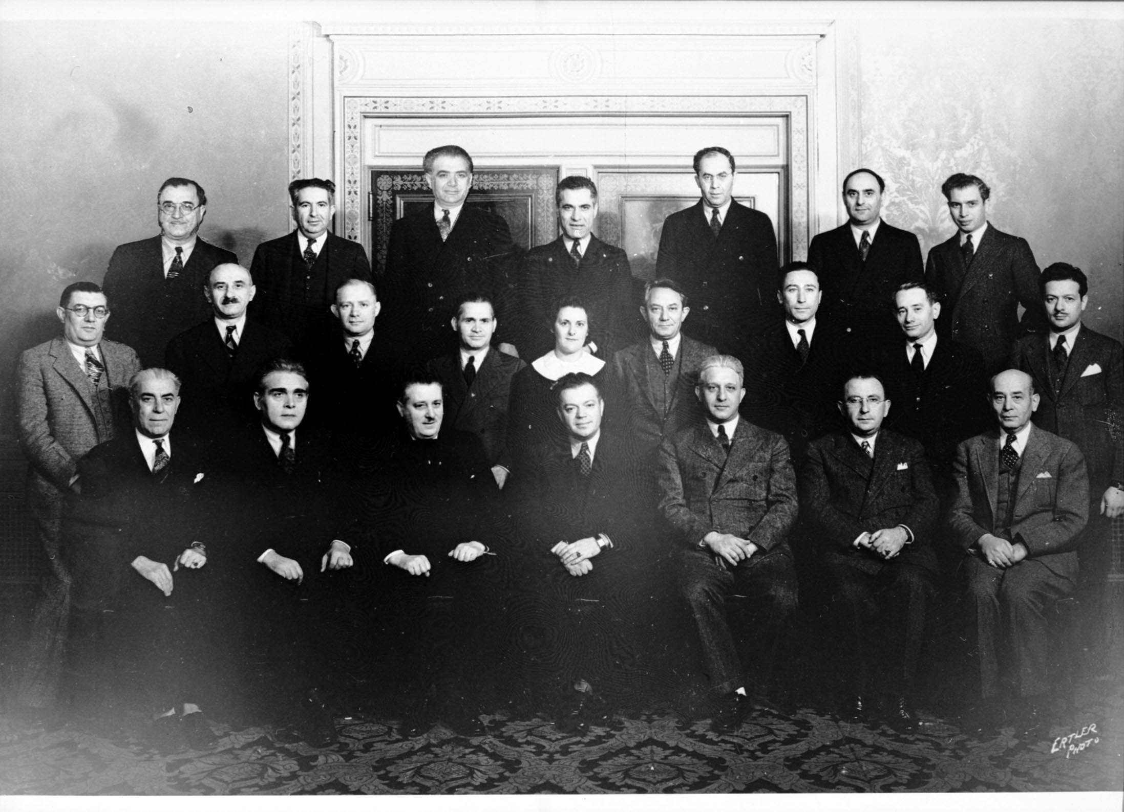 a group of people are wearing suits and ties