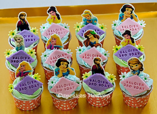 some cupcakes that have been decorated to look like disney princesses