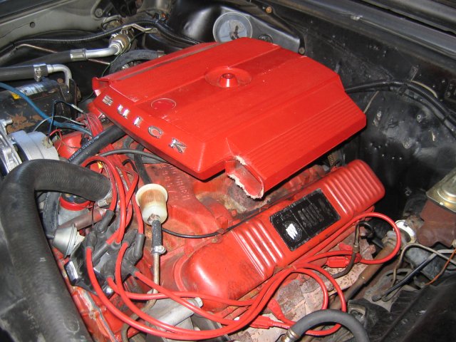 an engine bay with a car's hood up