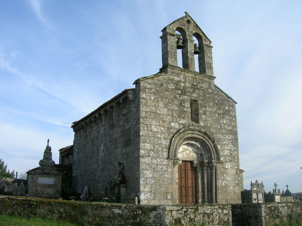 an old stone church with a clock tower on top