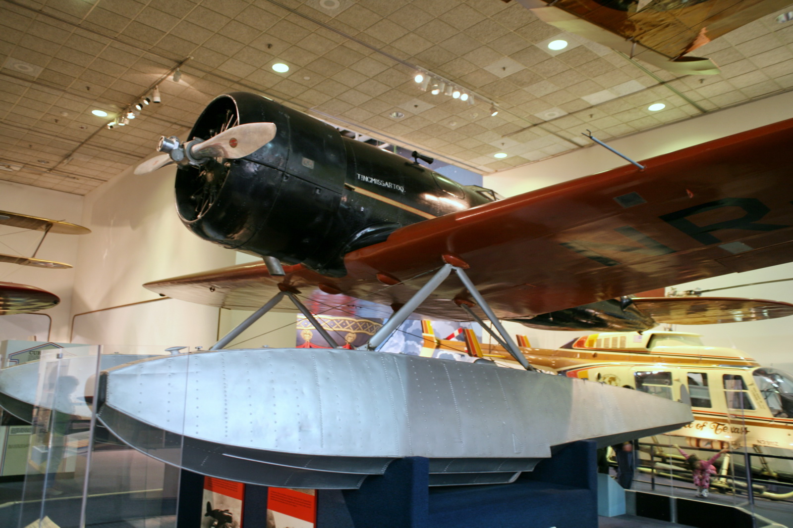 an airplane on display inside of a museum