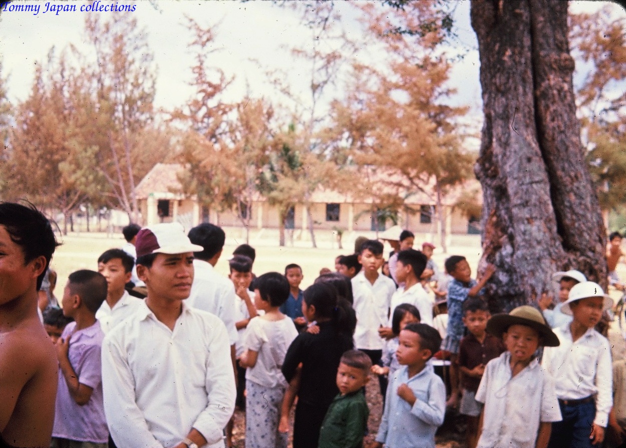 many people gathered together in the grass