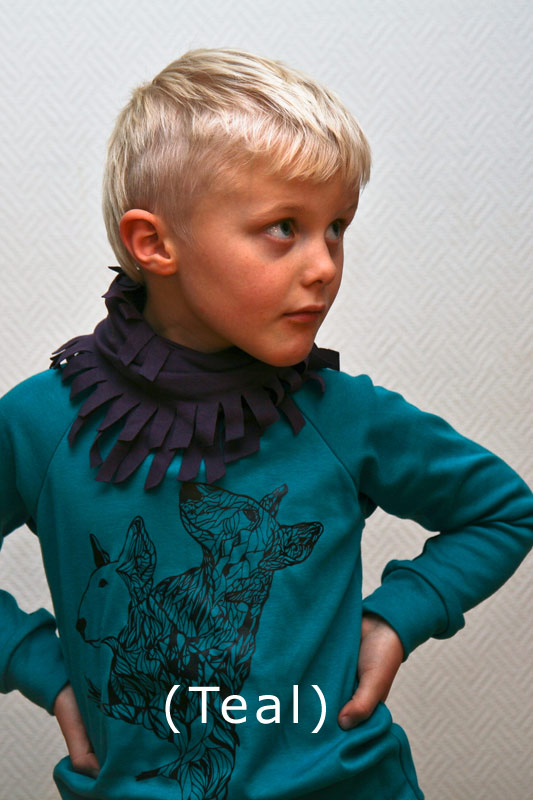 a child with blond hair wears a blue sweater