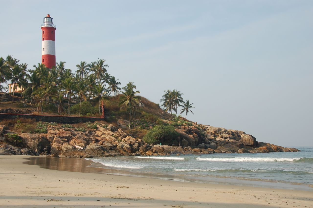 a light house on a small rocky mountain