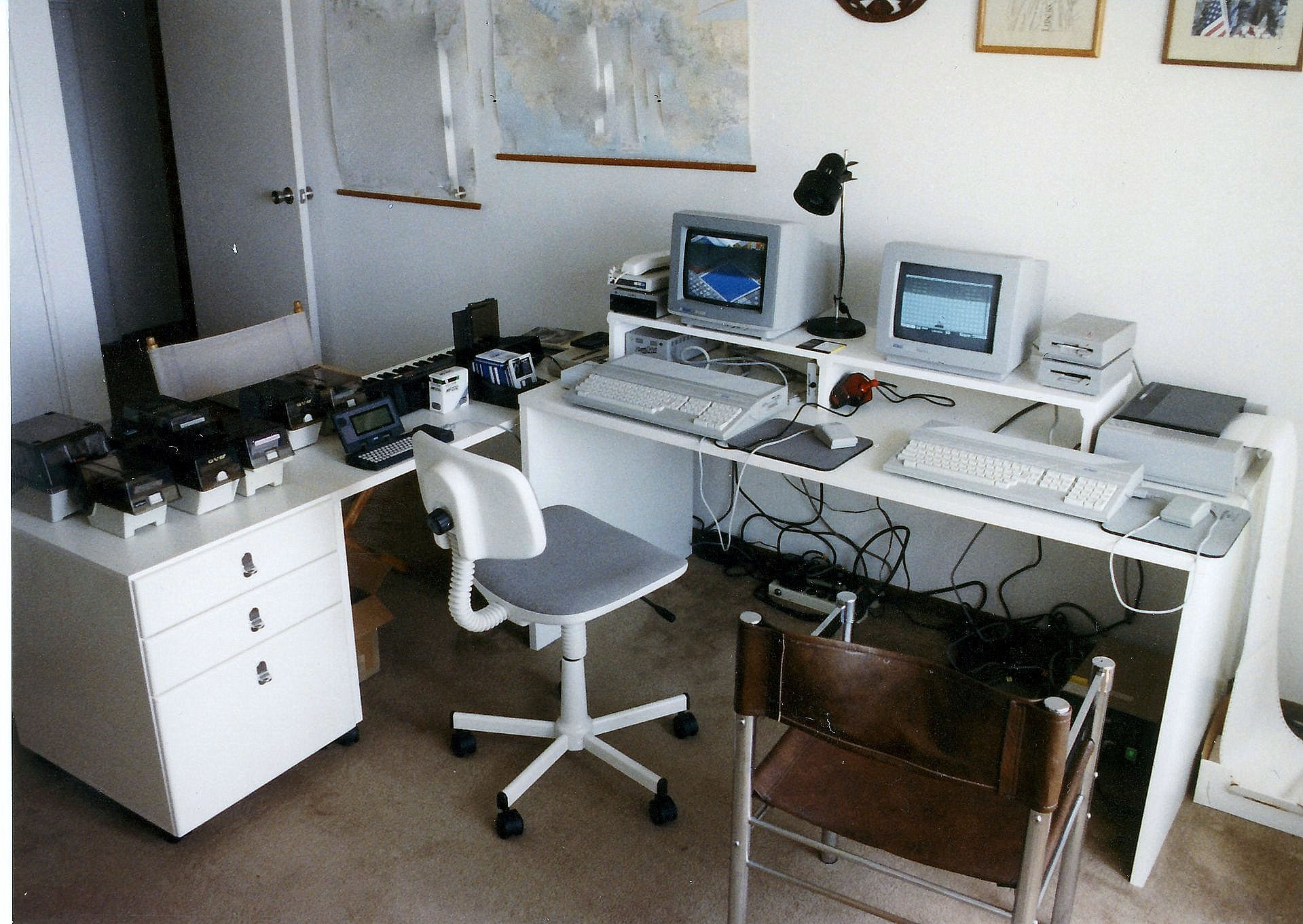 there is an older fashioned office with computers on it
