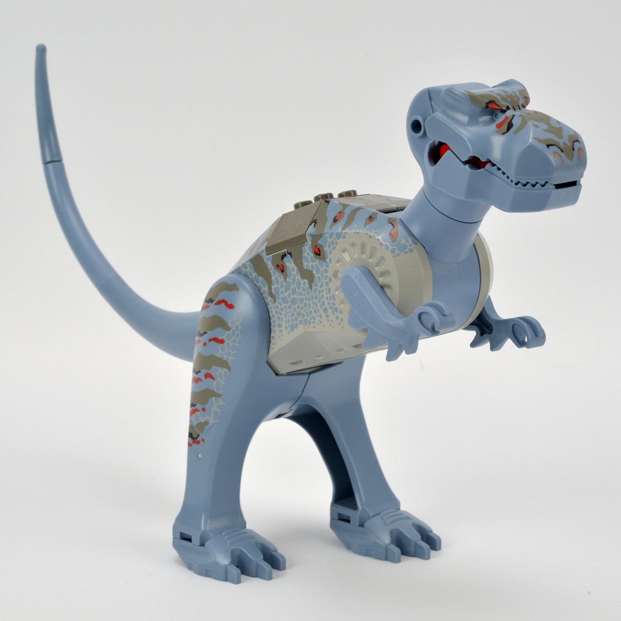 a plastic toy dinosaur wearing sports gear