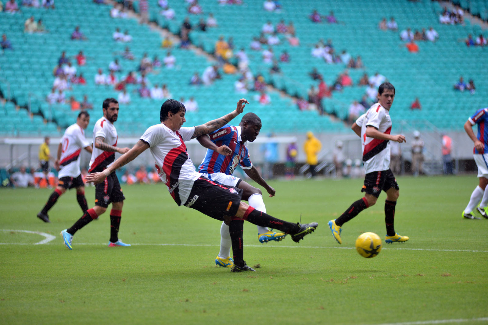 men playing soccer during the day on a field