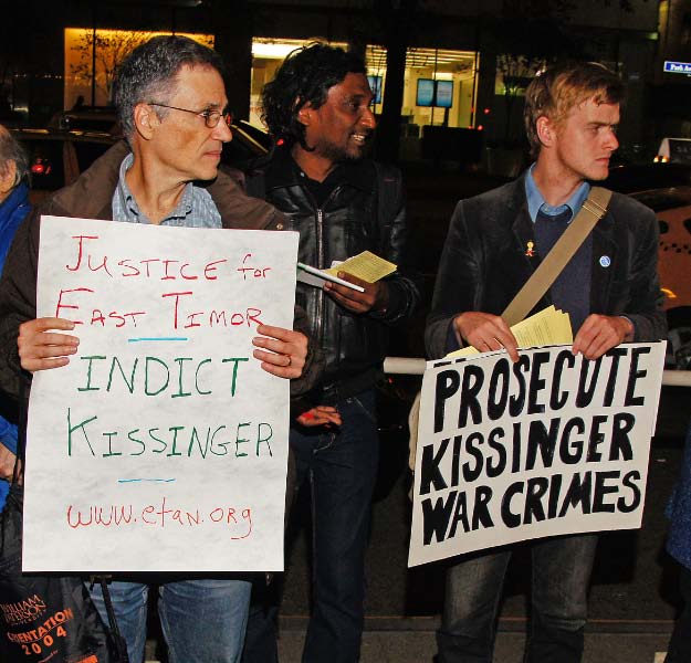 protestors holding signs with words protesting racism and violent kissing warcrimes