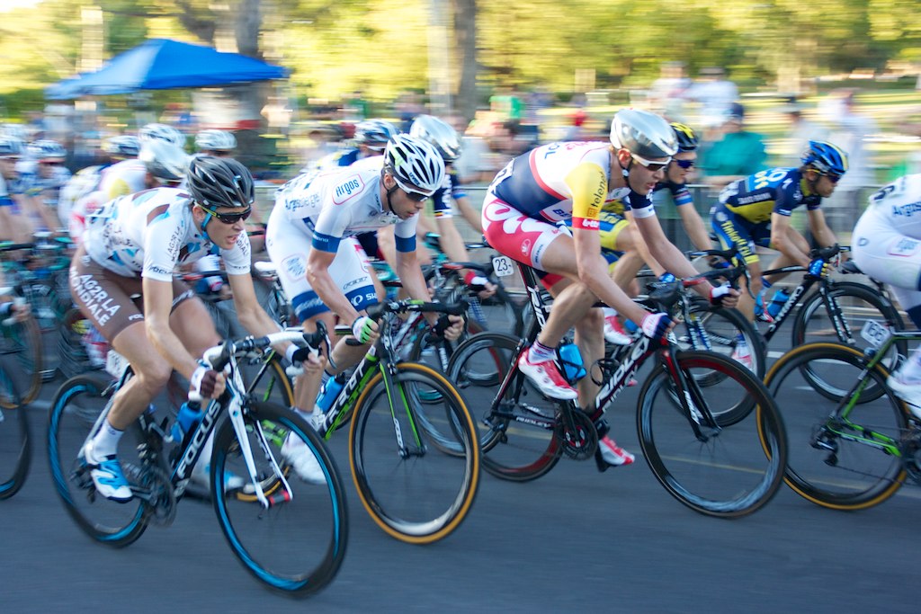 a line of cyclists racing on the road