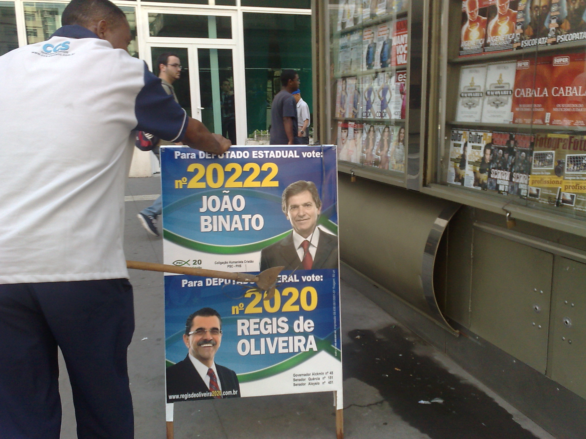 there is a man selling election posters