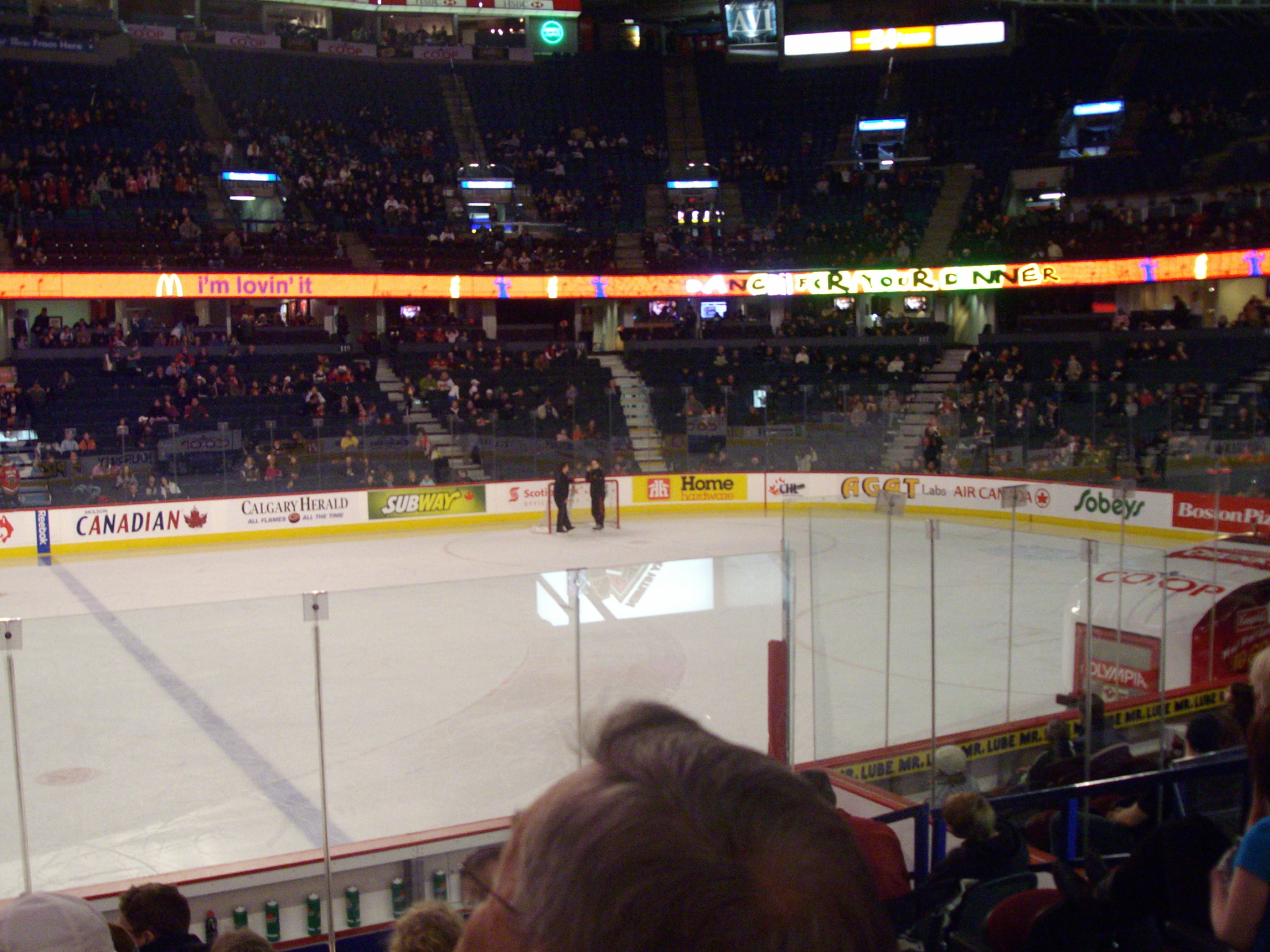 the ice hockey rink is packed with fans