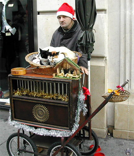 a man and his dog are sitting on top of a small cart