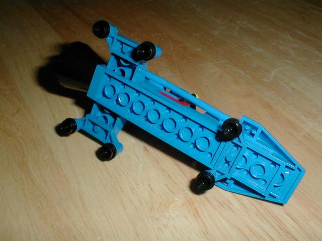 a blue toy car is shown with four wheels