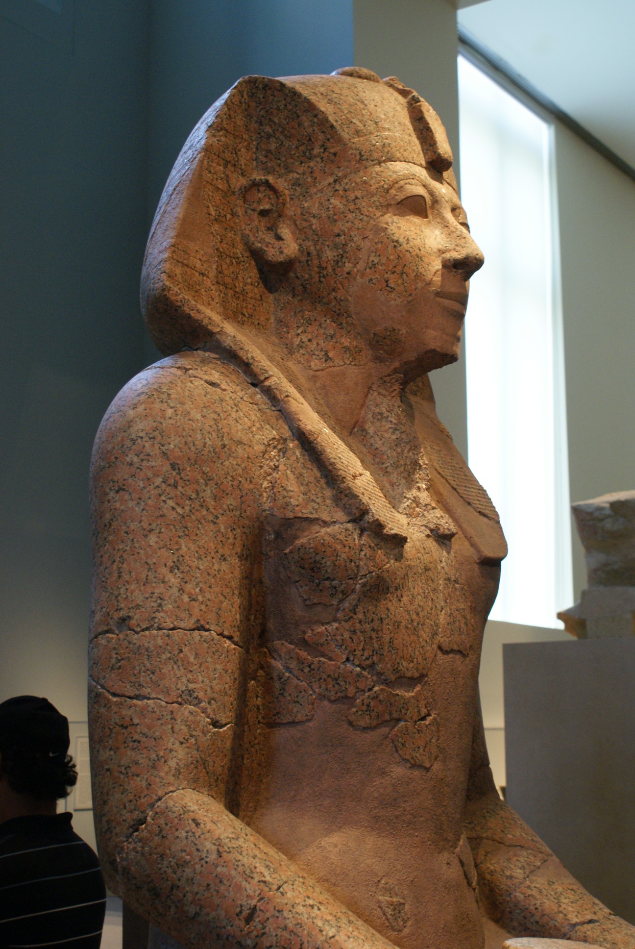 a large statue is shown in a museum