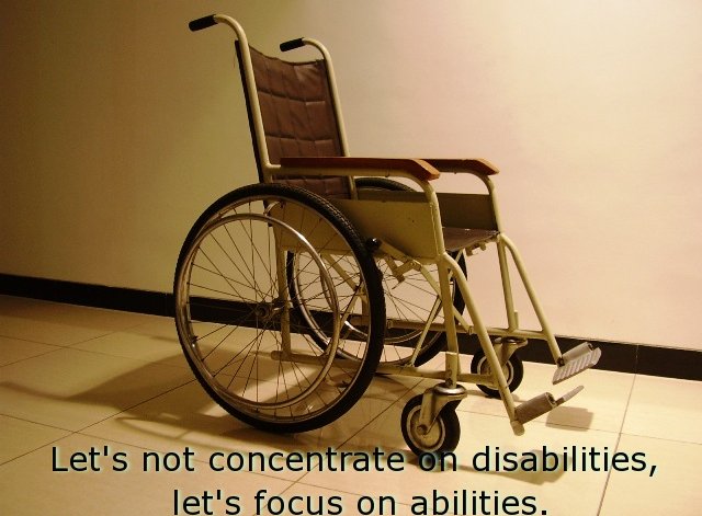 a wheelchair in the corner with a quote above it