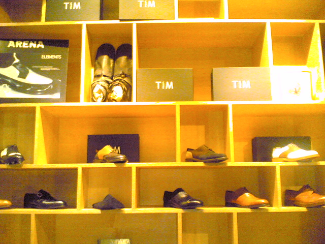 an assortment of shoes that are on display