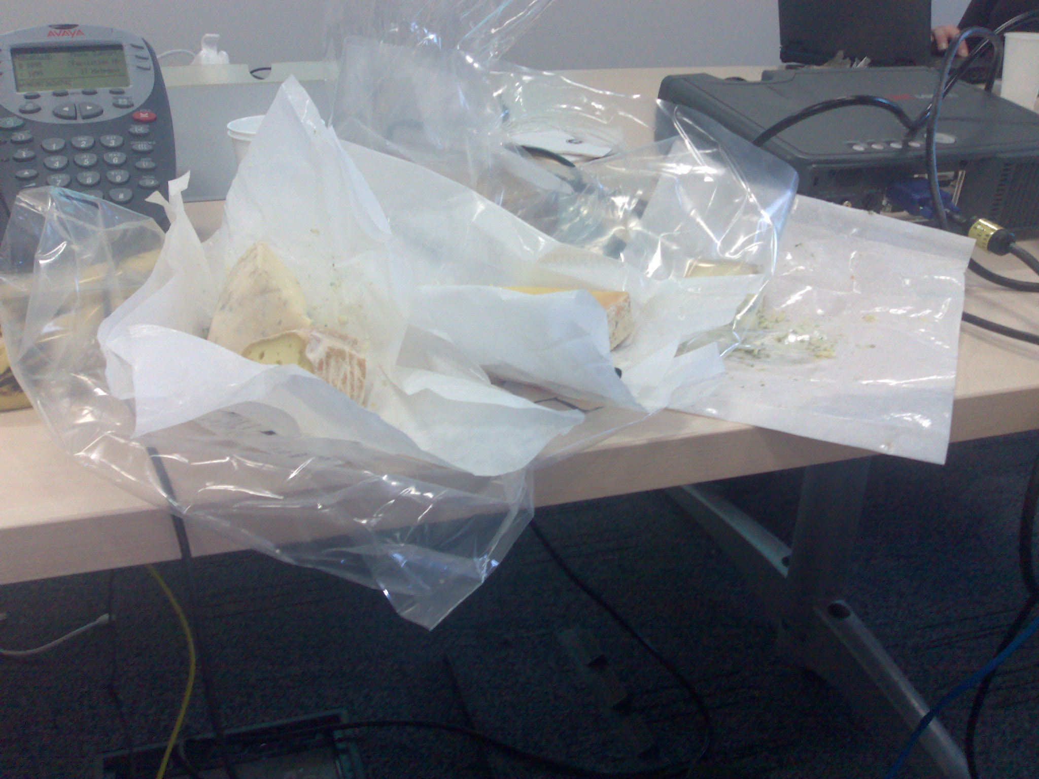 some food and plastic bag sitting on a desk