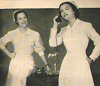 a black and white po of two women talking on phones