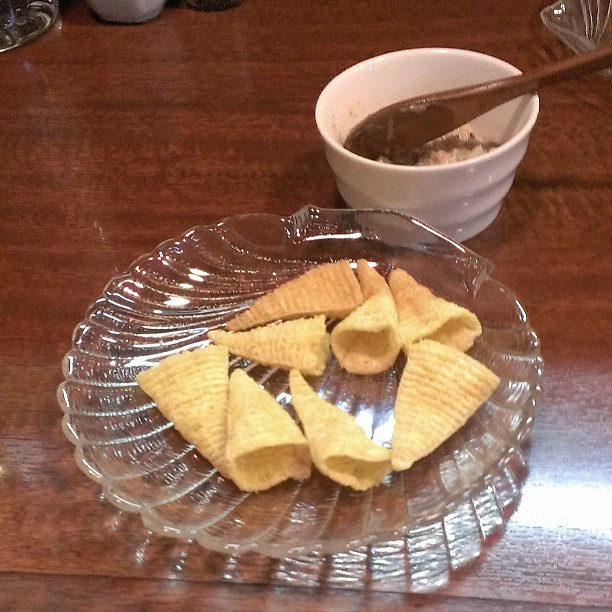 a glass plate holds ers and a cup of chocolate