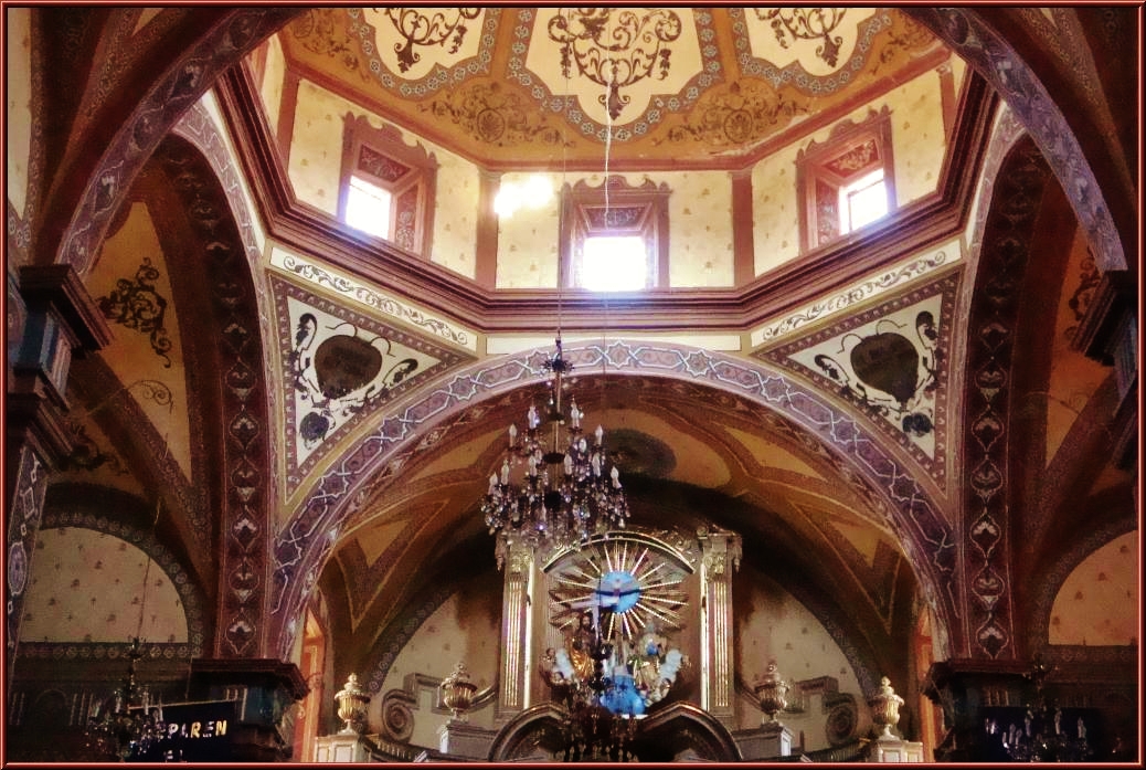 the chandelier and light in a small church