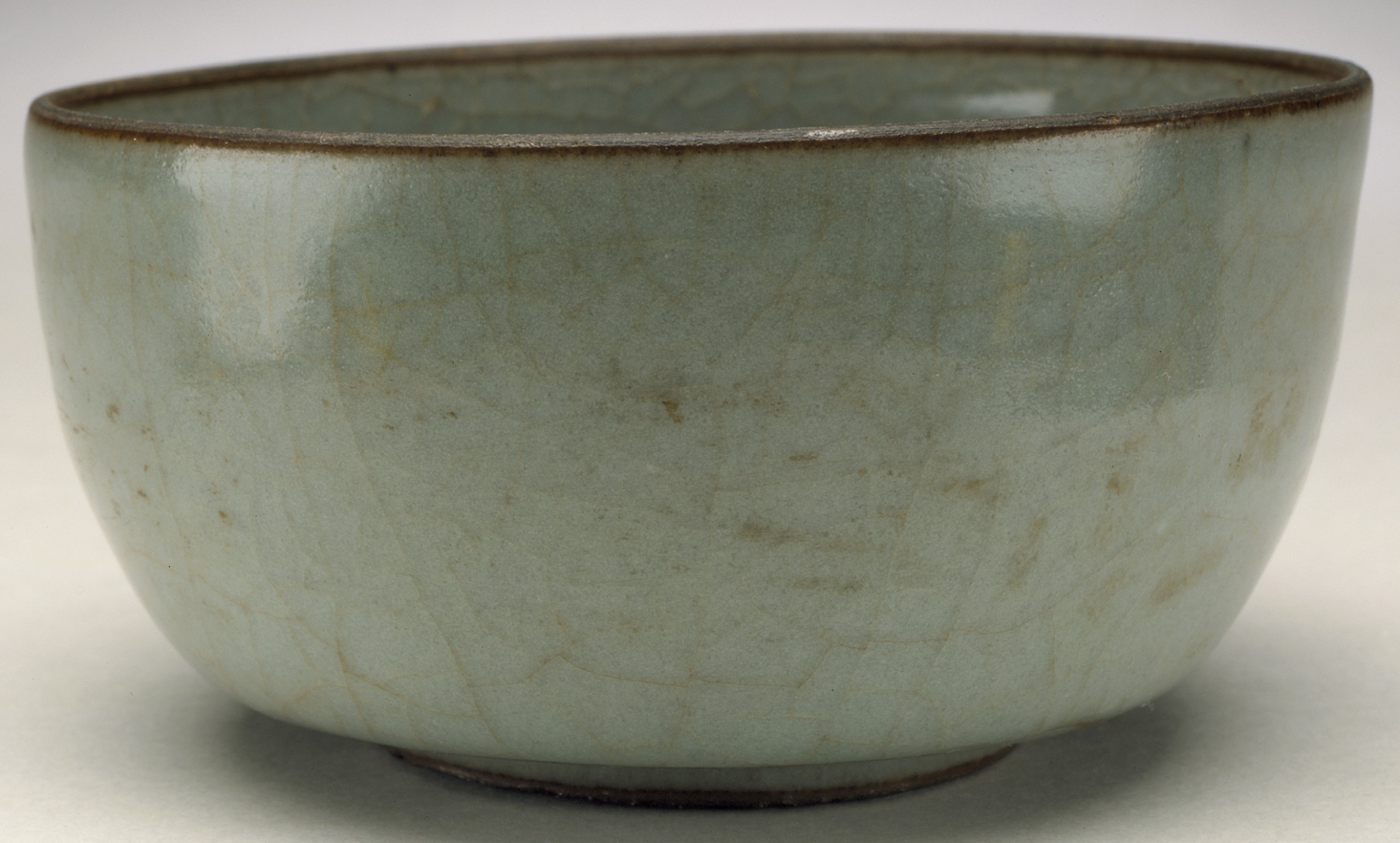 a small blue bowl sits empty on a table