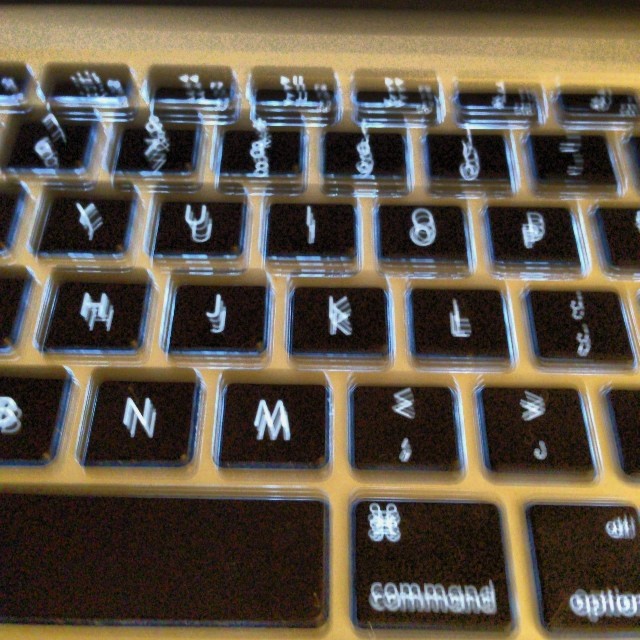 closeup of black and silver keyboard on laptop