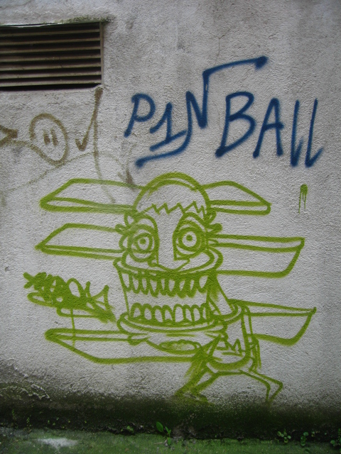 the wall is covered with graffiti that is green