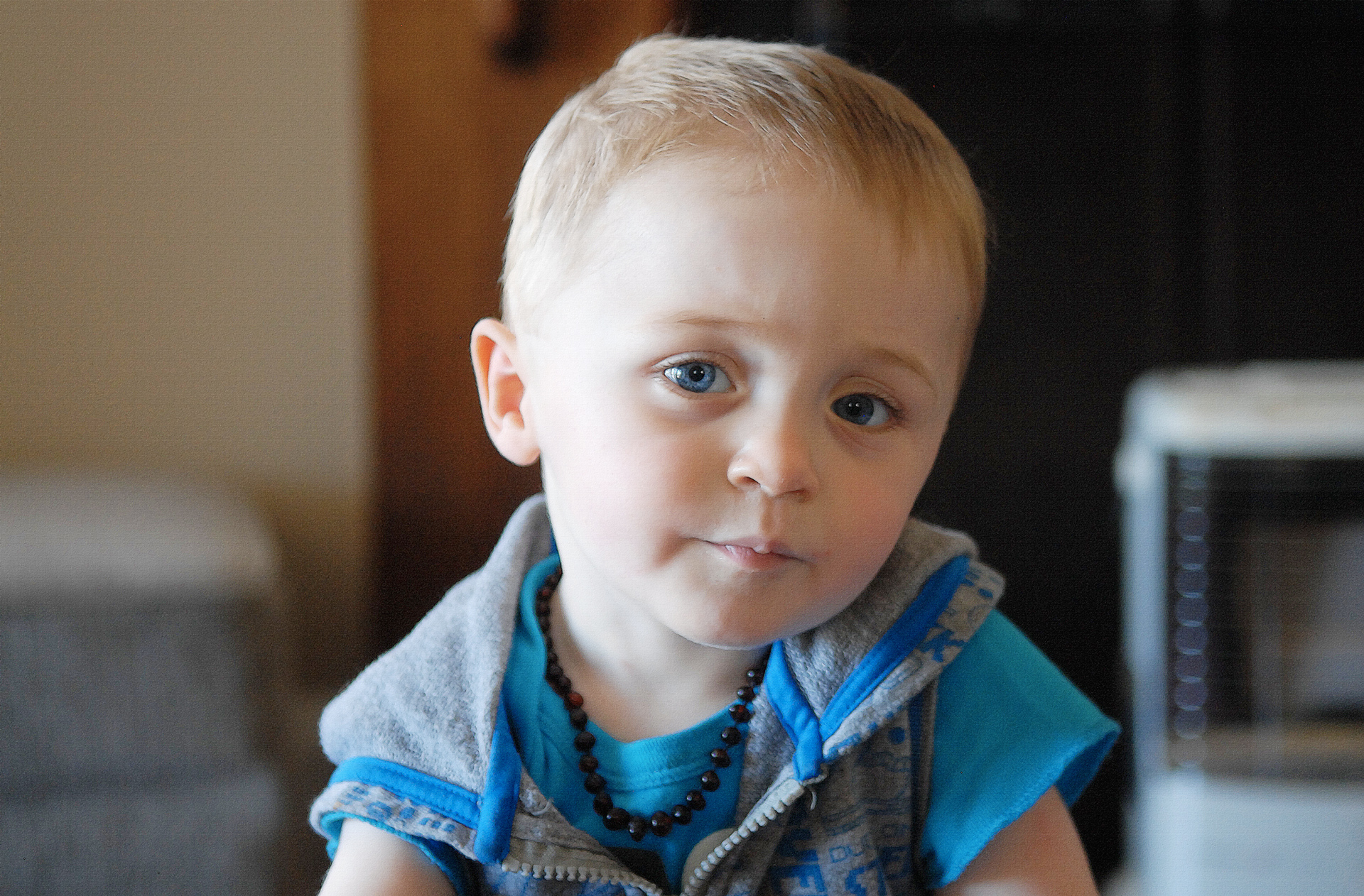 a close up of a child with a plate in hand