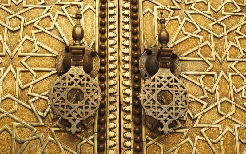 intricately designed wall with metal door handles and ss finish