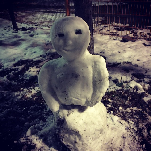 a snow sculpture is standing in the snow