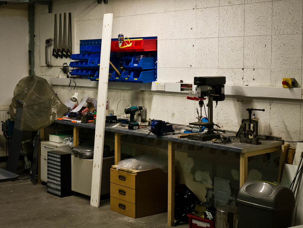 workbench with tools, machinery and various items