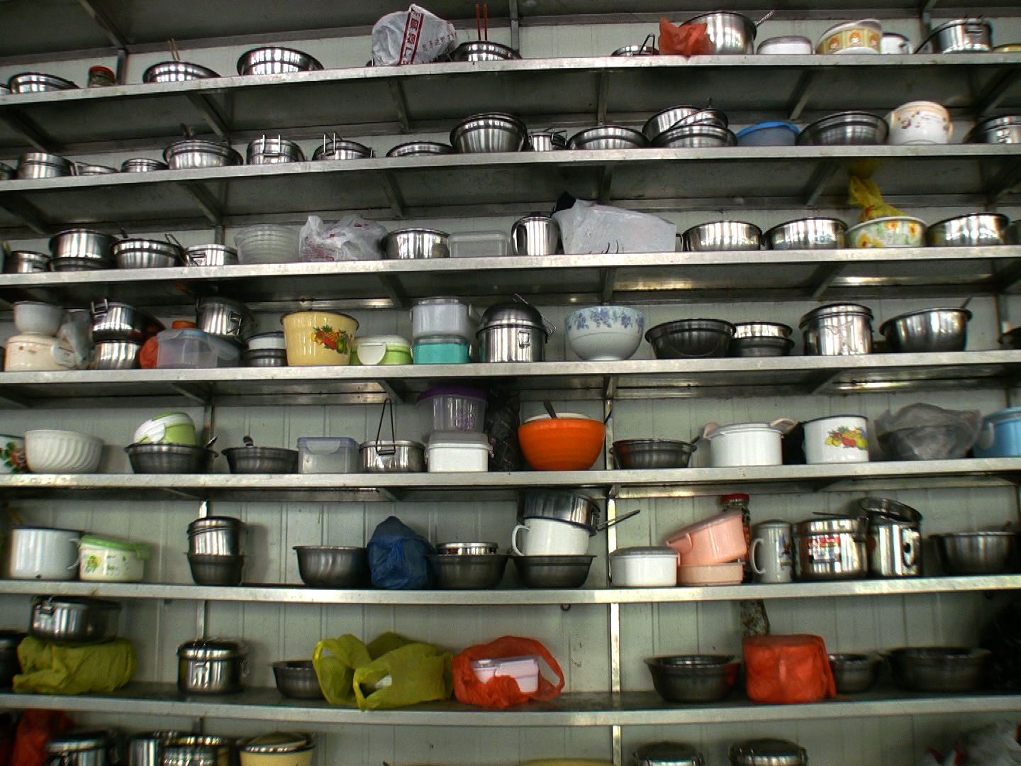 a bunch of silver shelves with some stuff on them