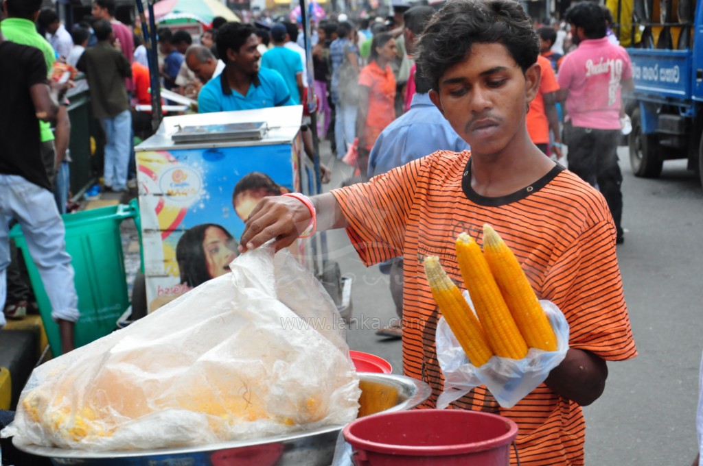  placing soing into a bag while looking at camera