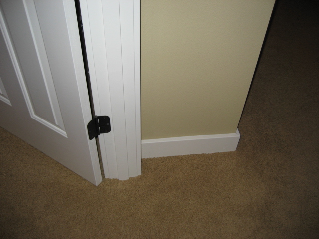 an open door with a small black latch