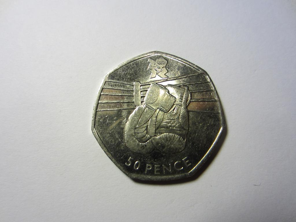 the side of an indian coin with a man playing guitar