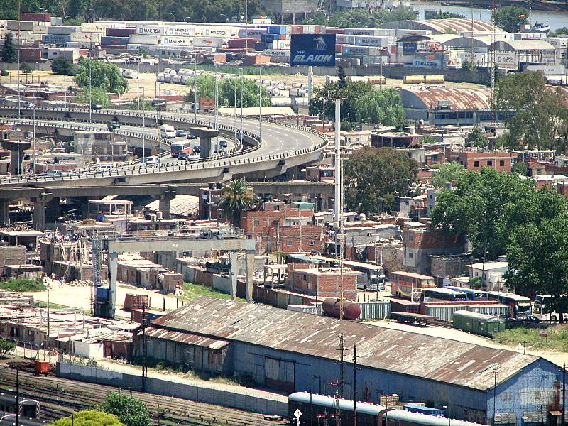 a street, buildings and a bridge seen from above