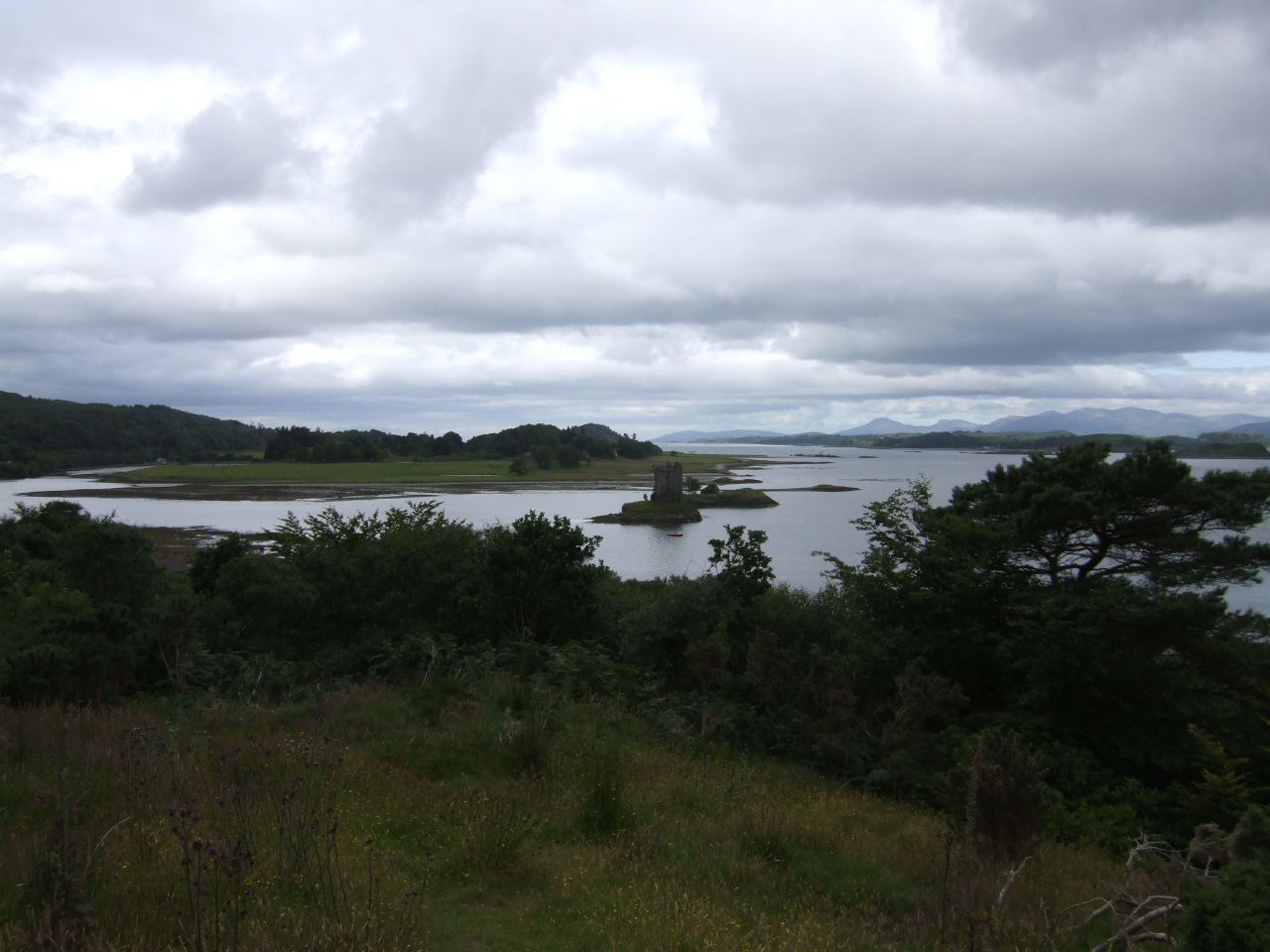 a beautiful landscape and lake in the background