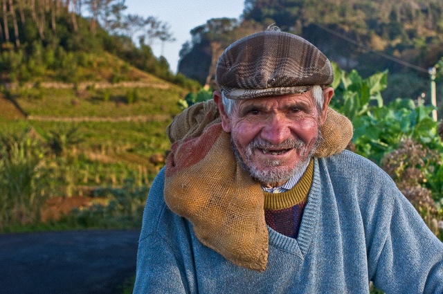 a man wearing a knitted hat and scarf