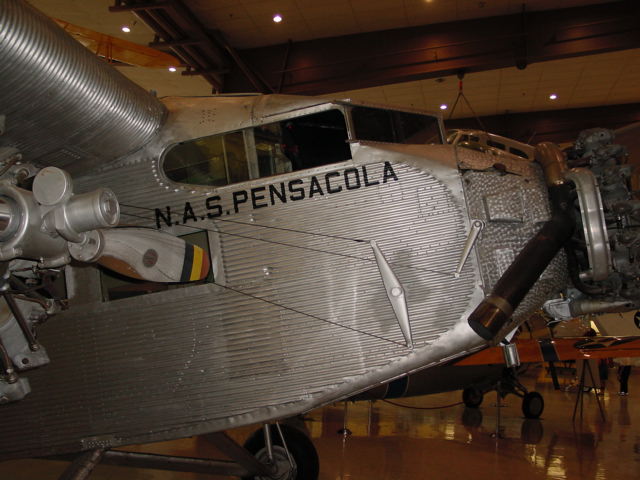 an old, single engine propeller airplane on display in the museum