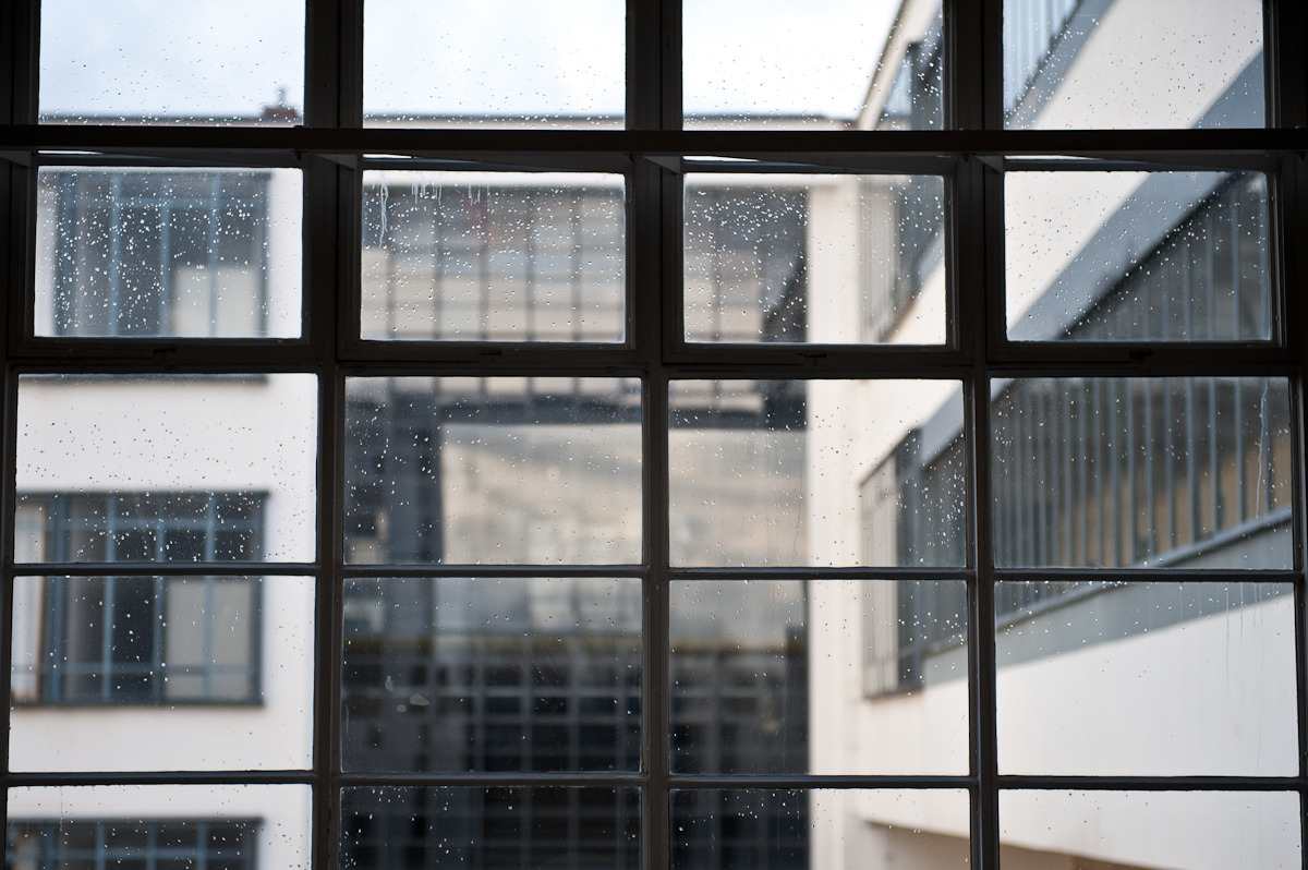 the back window of a building with raindrops