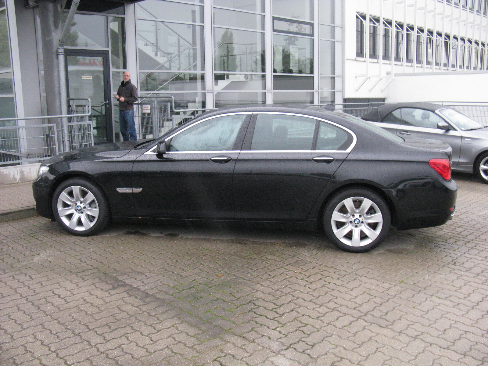 a black car parked in front of a building