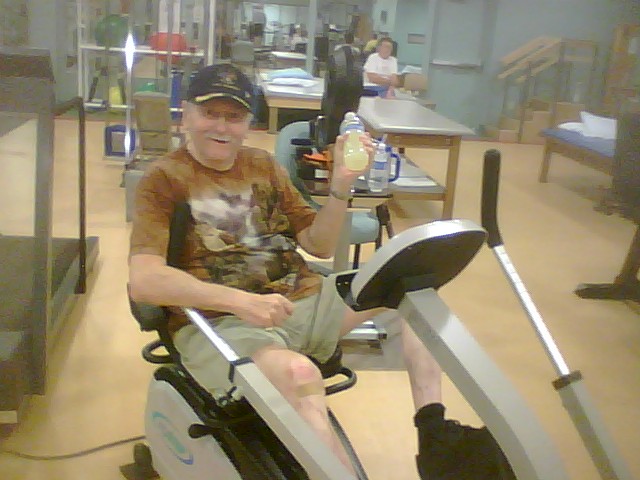 an older man is on a stationary exercise bike