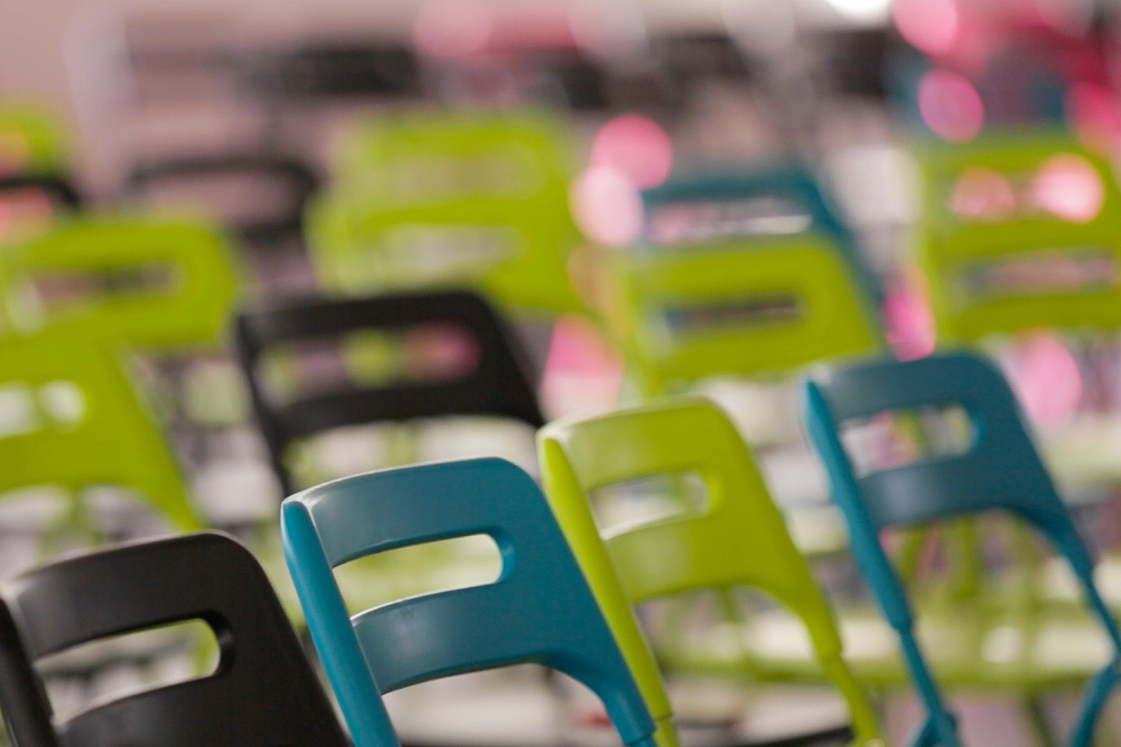 rows of colorful chairs with one of them closed