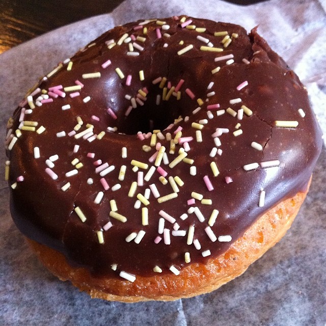 a doughnut covered in chocolate and sprinkles