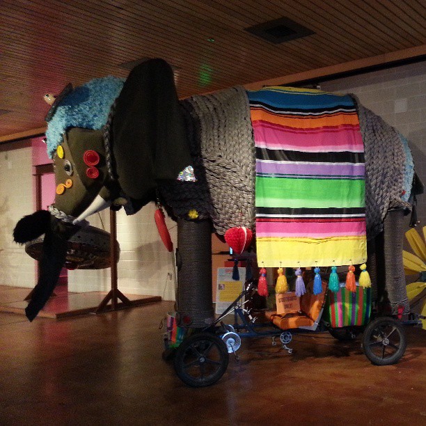 the elephant is decorated with brightly colored fabric
