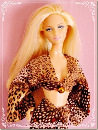 barbie doll dressed in leopard print swimsuit and brown boots