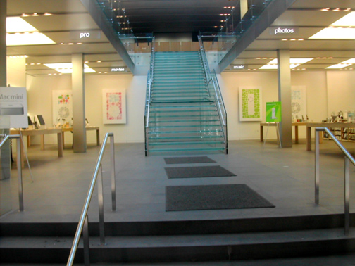 a building filled with metal railings and a set of stairs