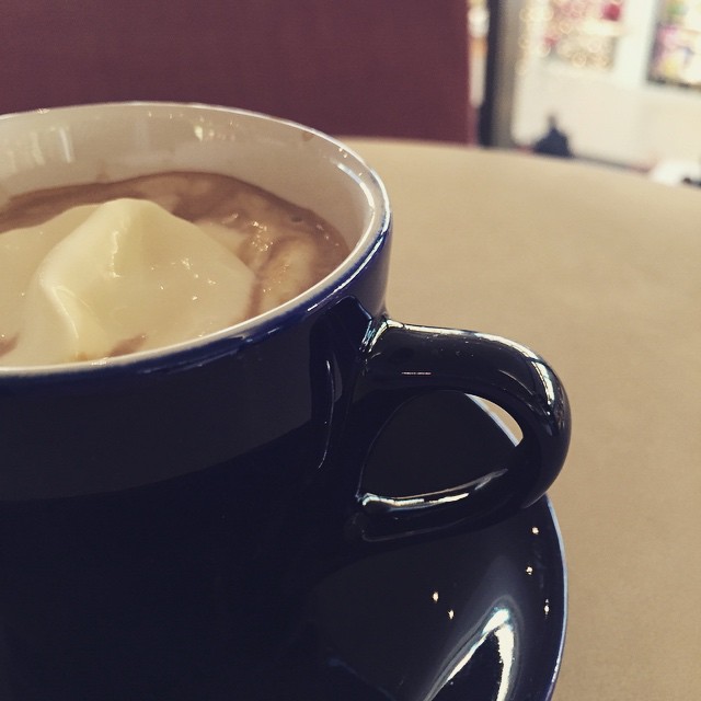 cup of soup with dumplings in the bowl