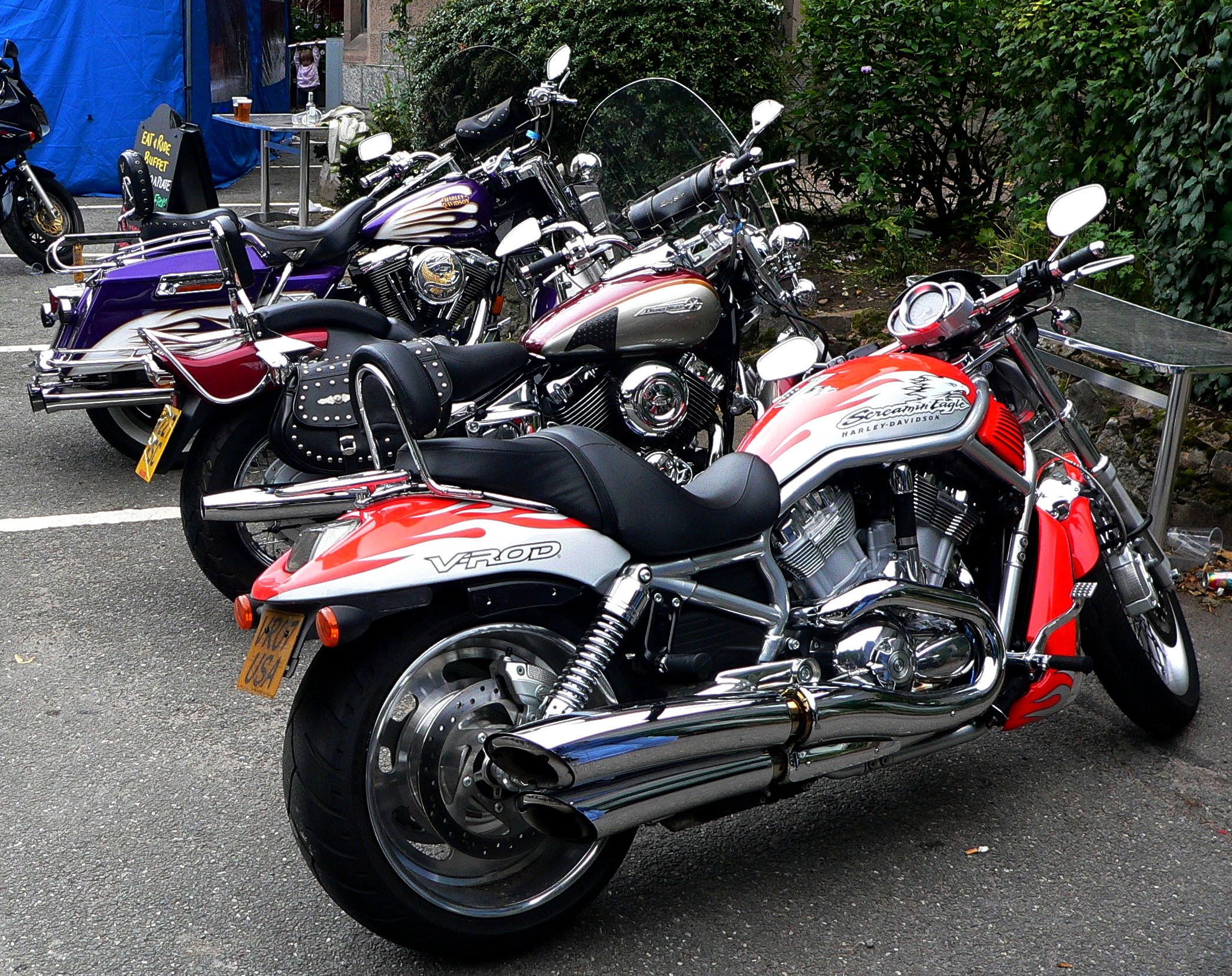 many motorcycles parked in rows next to each other