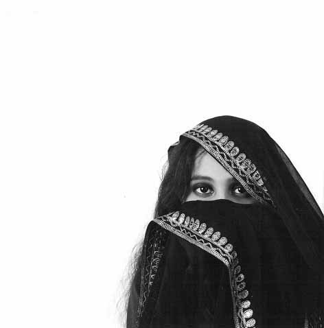 black and white pograph of a girl wearing head covering